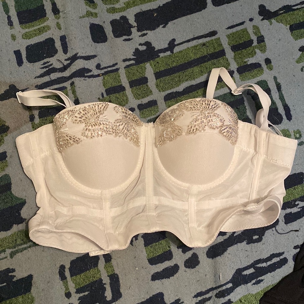 white corset top with beads in the shape of butterflies